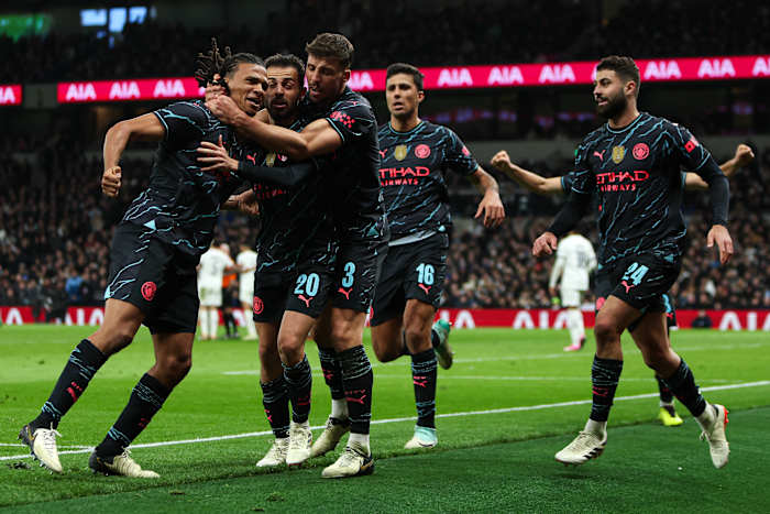 Manchester City's players pictured celebrating after a late goal scored by Nathan Ake (left) earned a 1-0 win at Tottenham Hotspur in the FA Cup in January 2024